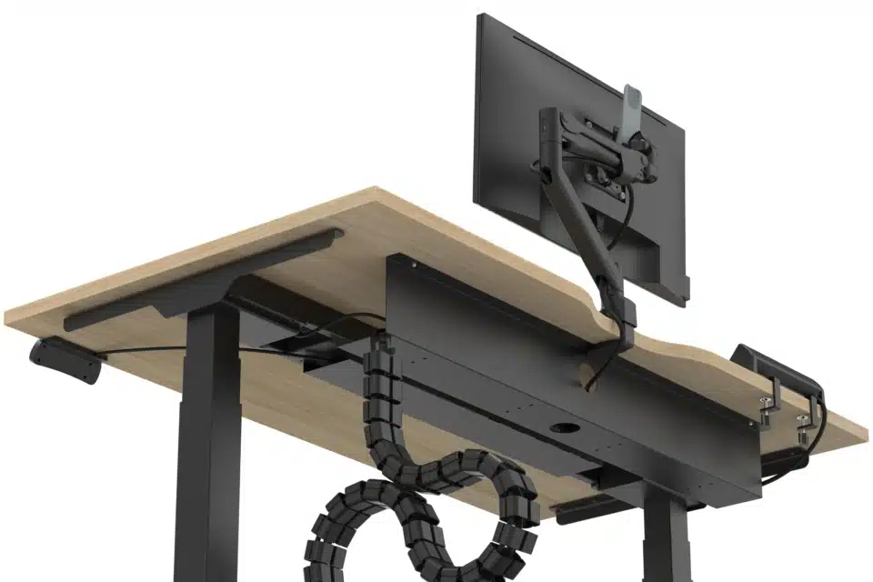 Underside of desk showing black cable tray and management spine.