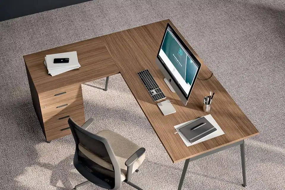 Collaborative X3 desks in a bright room with screens and divider panels.