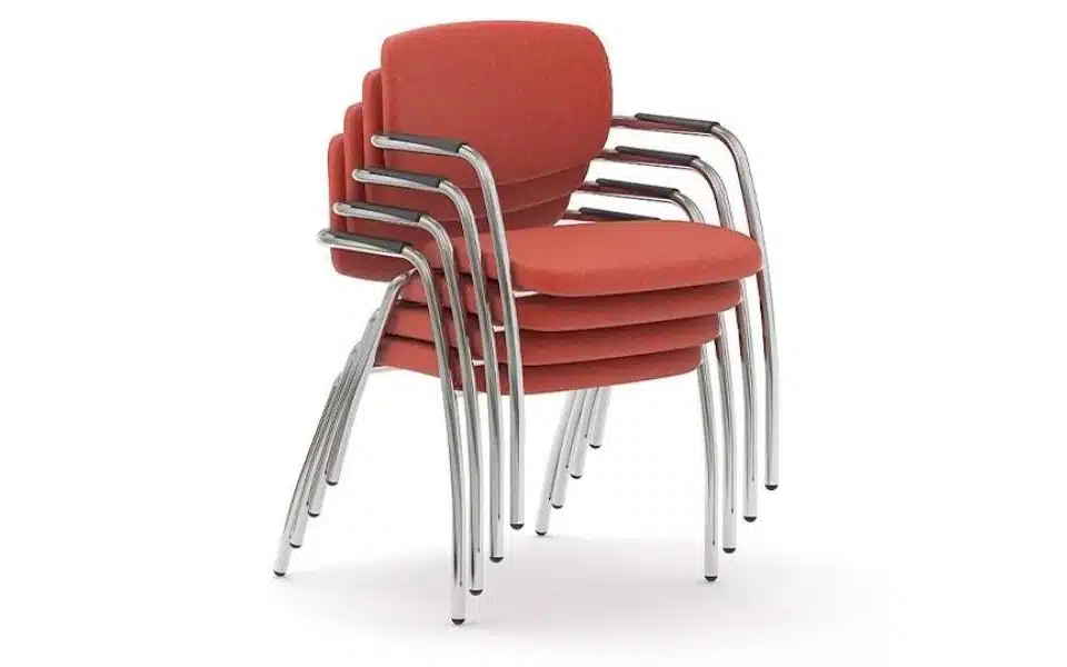 Stack of four Narbutas Gama meeting chairs with red upholstery and chrome frames.