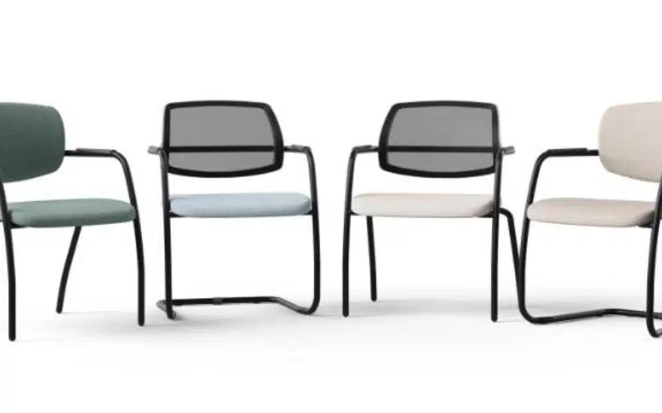 Variety of Narbutas Gama meeting chairs with mesh and upholstered backs on black frames.