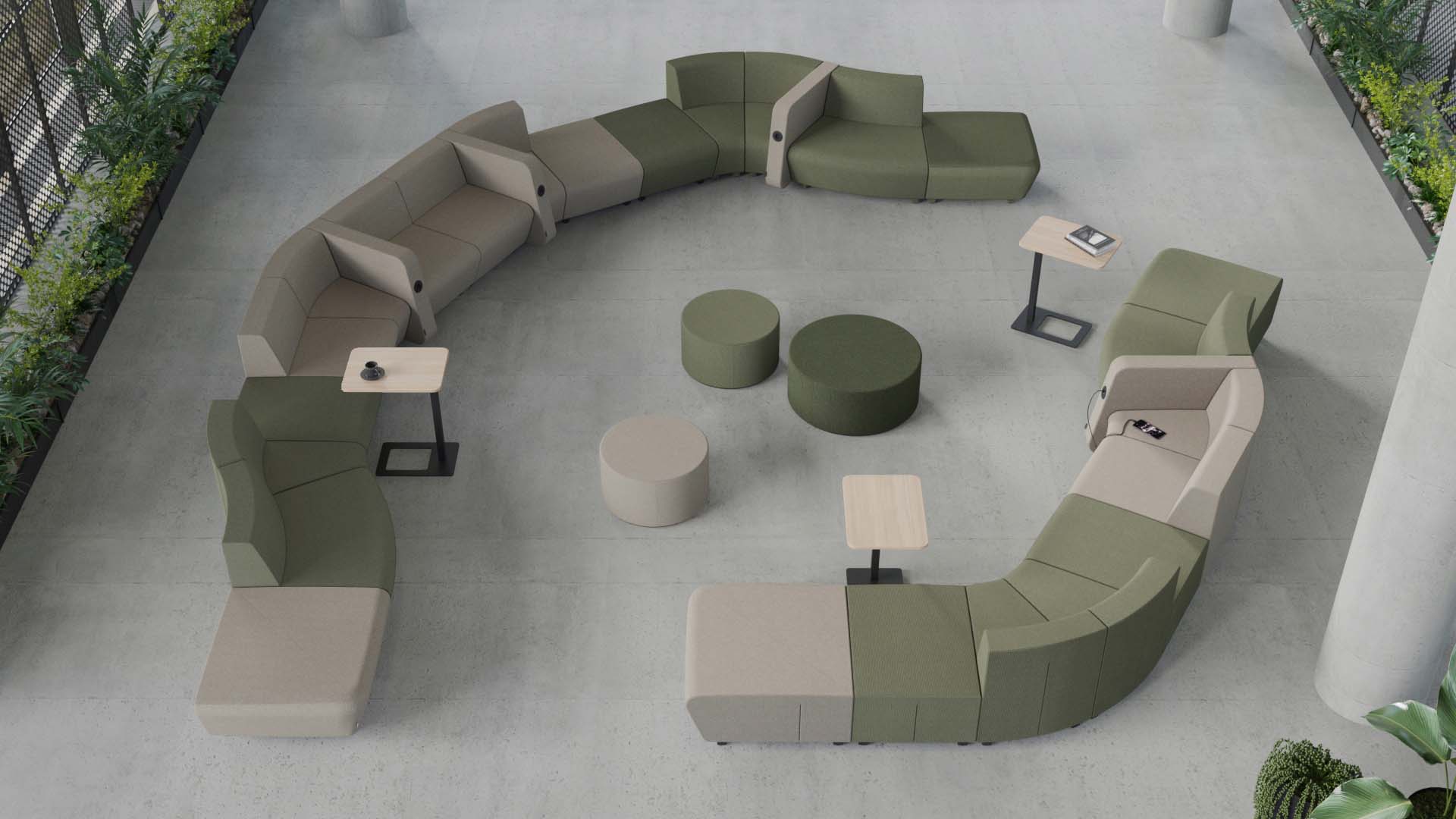 Top-down view of a modern office lounge featuring a semi-circular green and beige modular sofa.