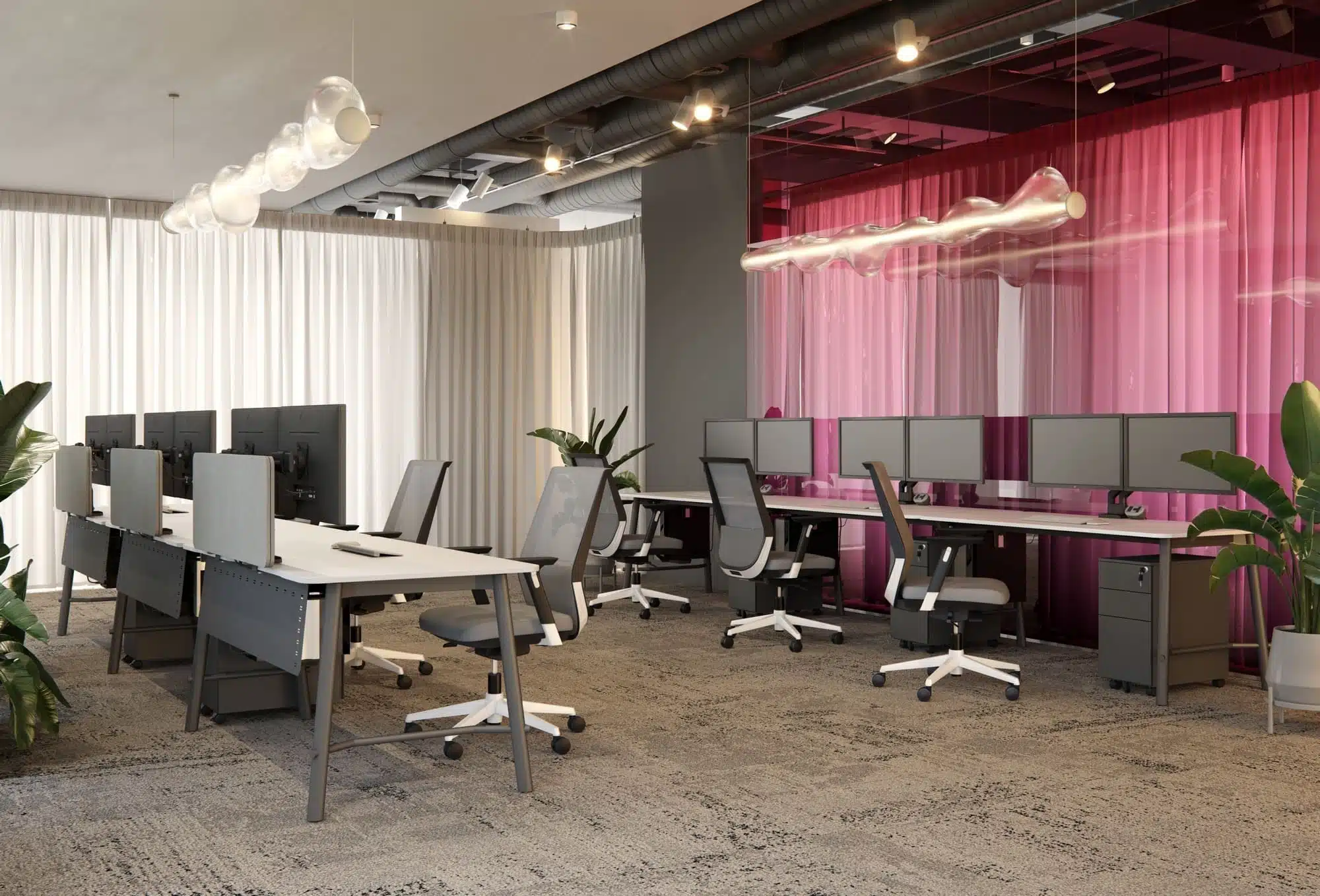 A modern open-plan office with rows of grey and white Elite Loop mesh task chairs, paired with white desks and dual-monitor setups.