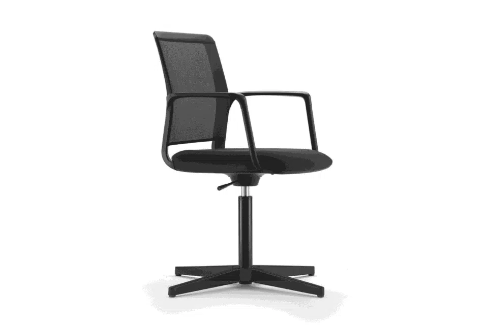 A side facing view of an all-black modern office chair with a square mesh backrest, curved armrests, and a four-star stationary pedestal base.