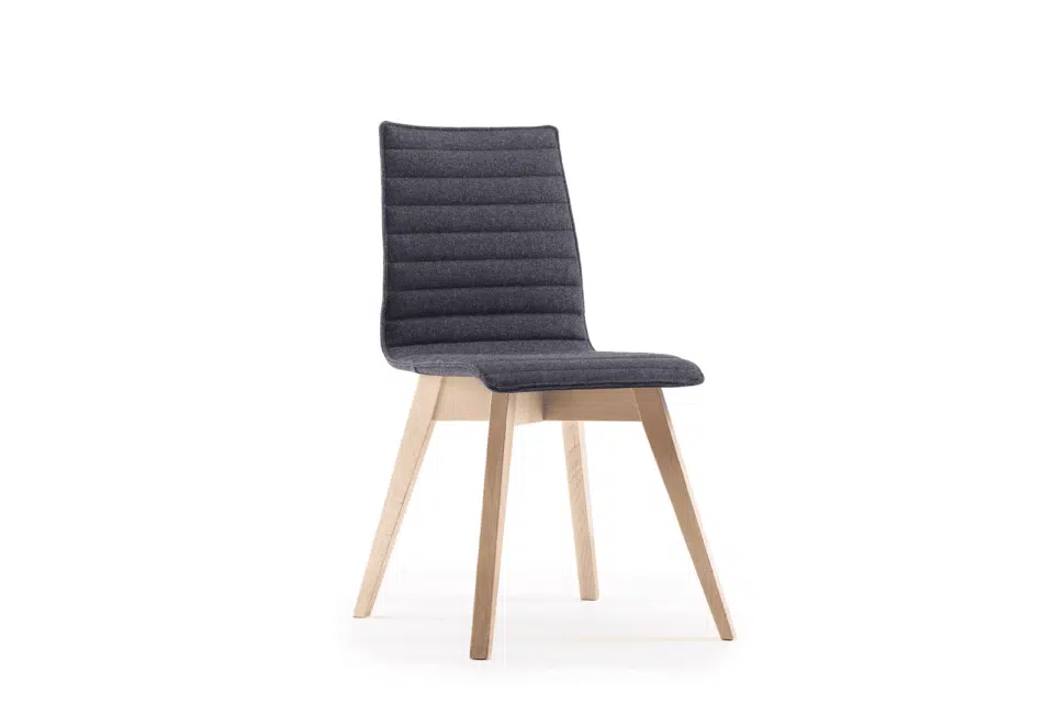 Bjorn chair featuring charcoal ribbed fabric upholstery and tapered light oak beech wood legs.