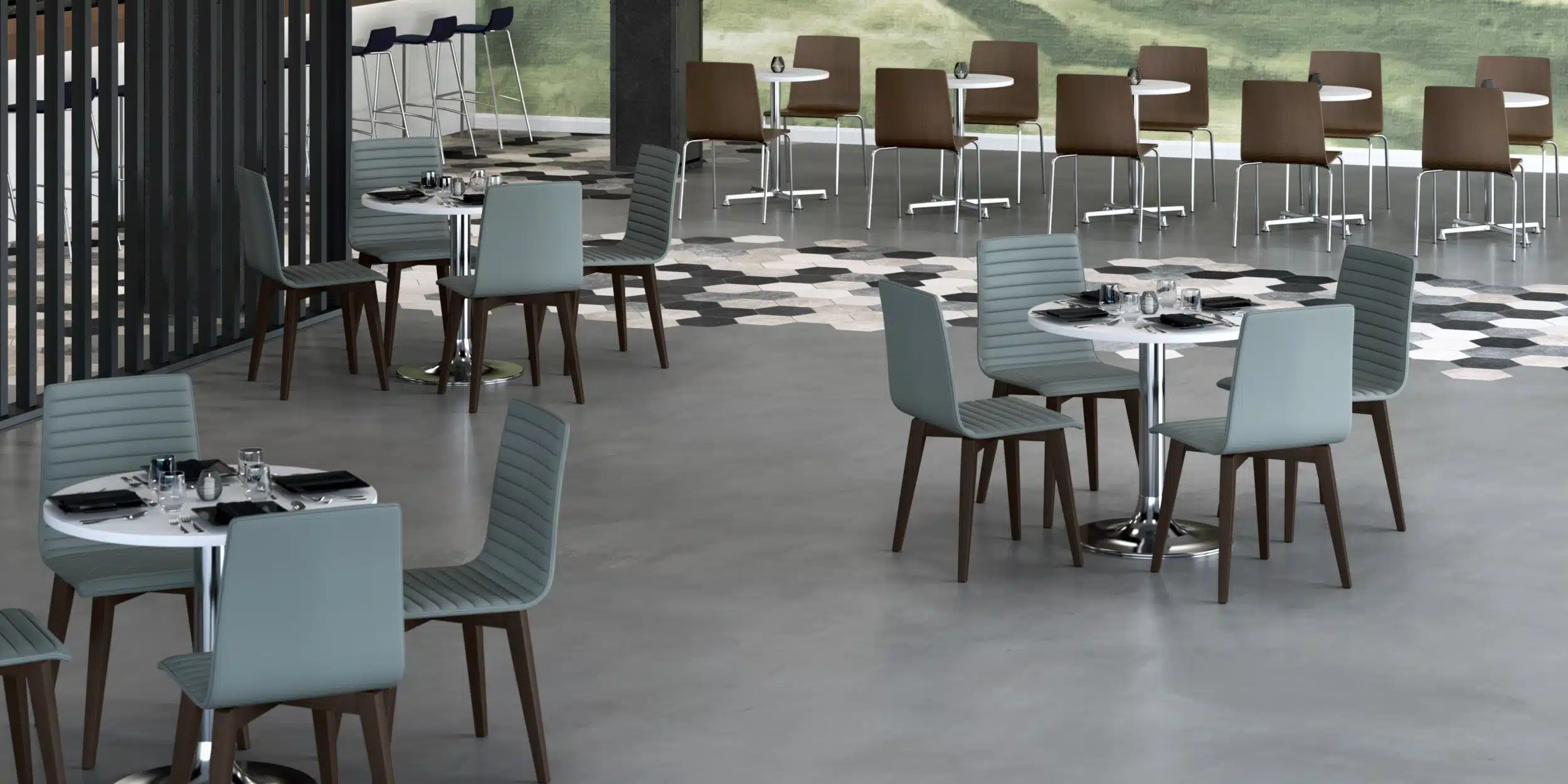 Modern cafe seating featuring light blue upholstered chairs, white round tables, and dark wood legs on a polished concrete floor.