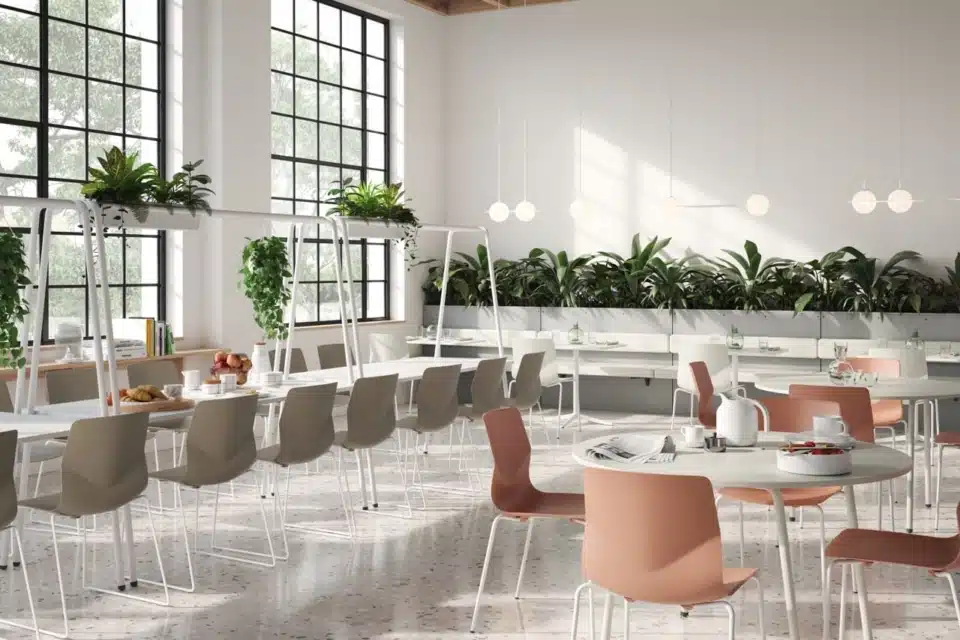 FourPeople® terracotta modular sofa and blue privacy screens in a modern office atrium.