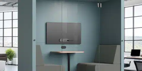 Blue acoustic pod in a spacious office.