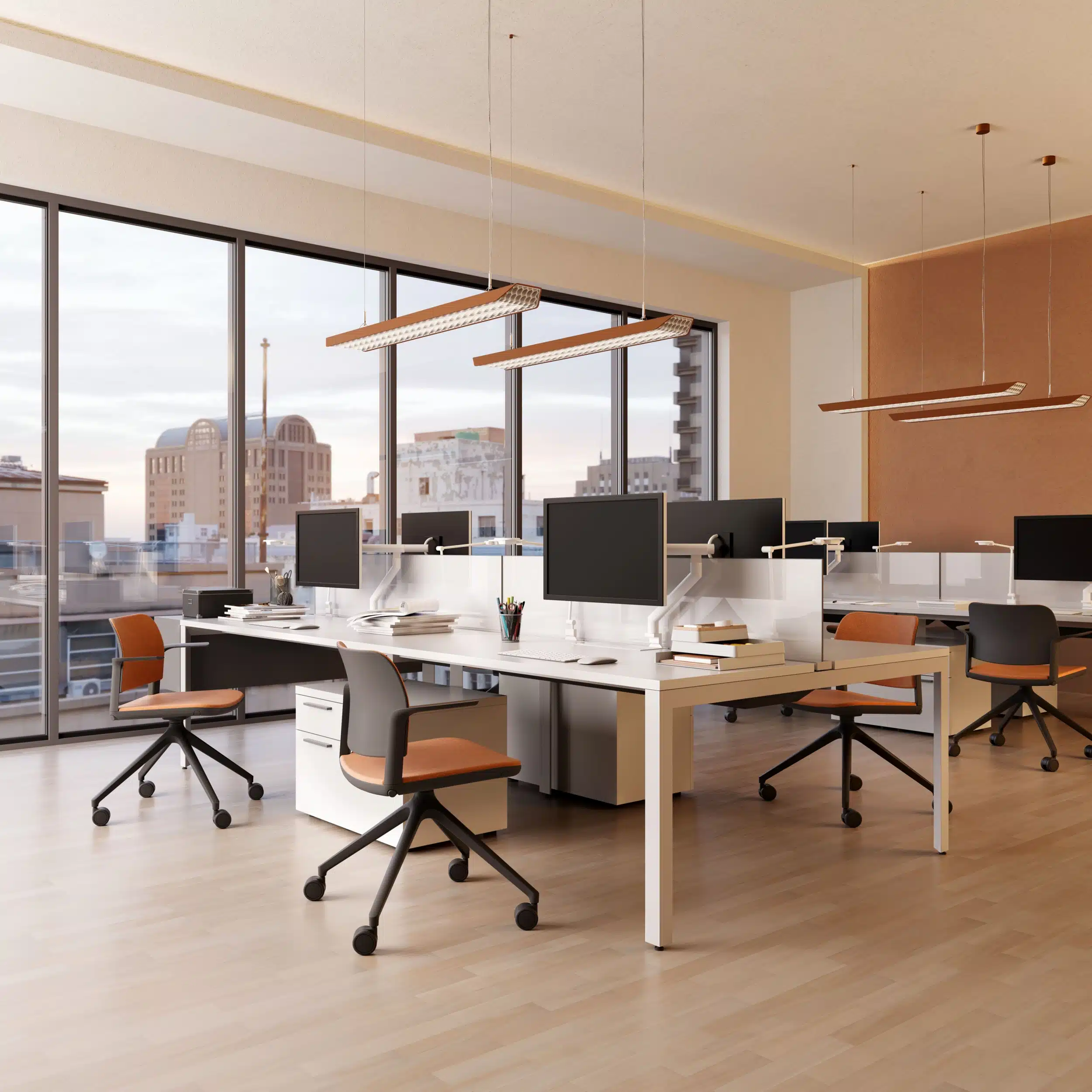Ciao height-adjustable mobile office chair with orange upholstery and black frame in a modern open plan workspace by iQ Workspace.