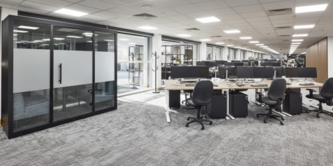 Modern open-plan office at MSC Ipswich featuring a black acoustic meeting pod, Imperial sit-stand desks and ergonomic chairs.