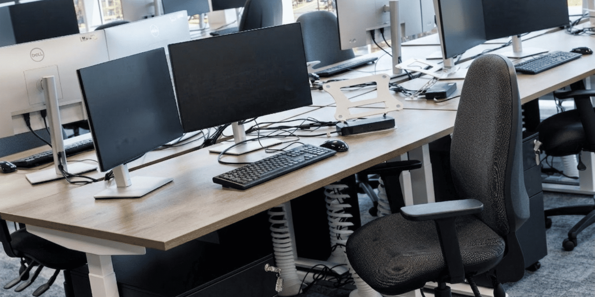 A close-up photograph focusing on an individual workstation within the brightly lit MSC Ipswich open-plan office.