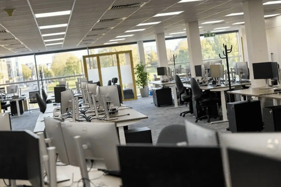 A close-up photograph focusing on an individual workstation within the brightly lit MSC Ipswich open-plan office.
